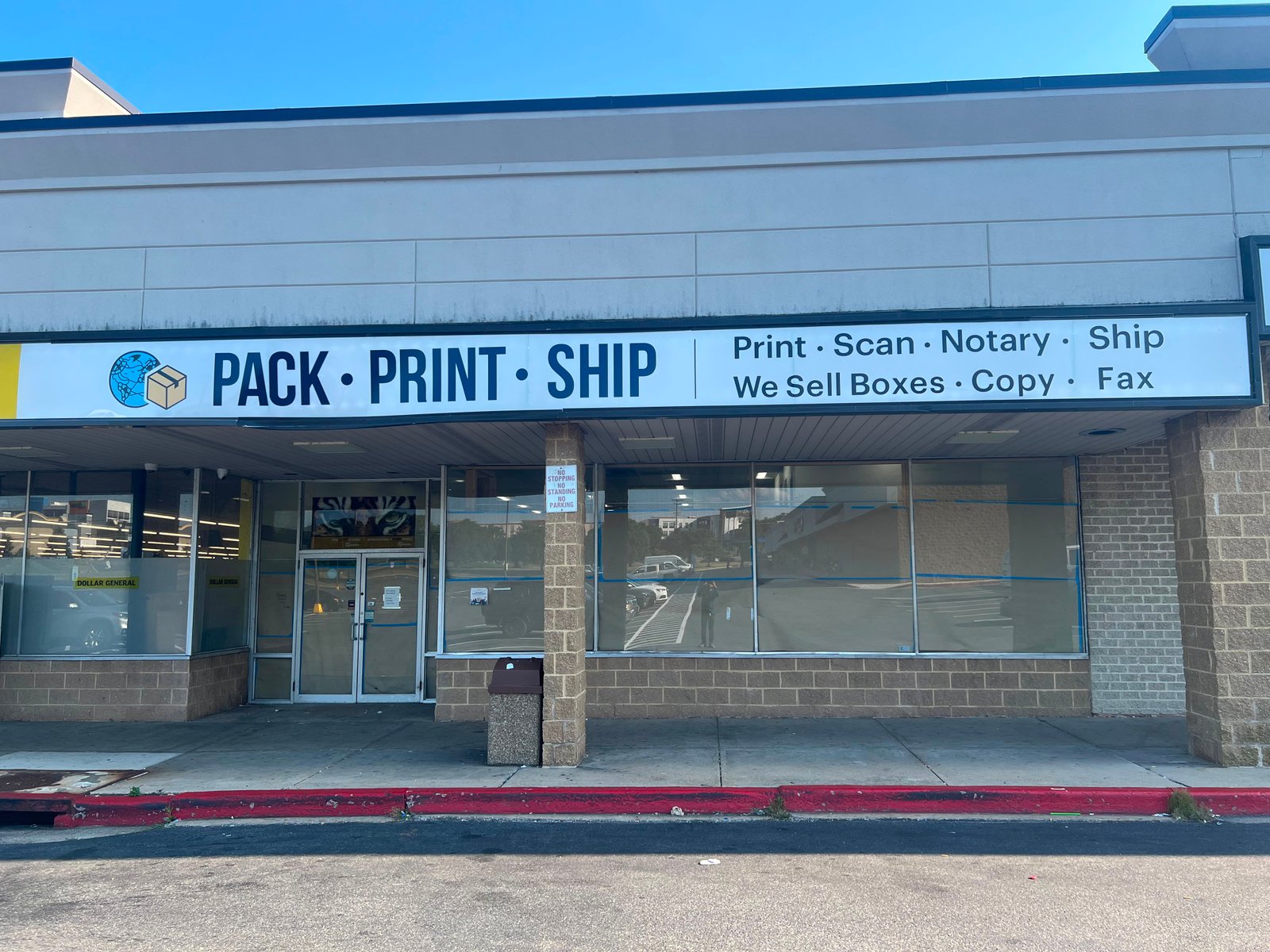 Pack Print Ship service counter with FedEx, UPS, and DHL signage